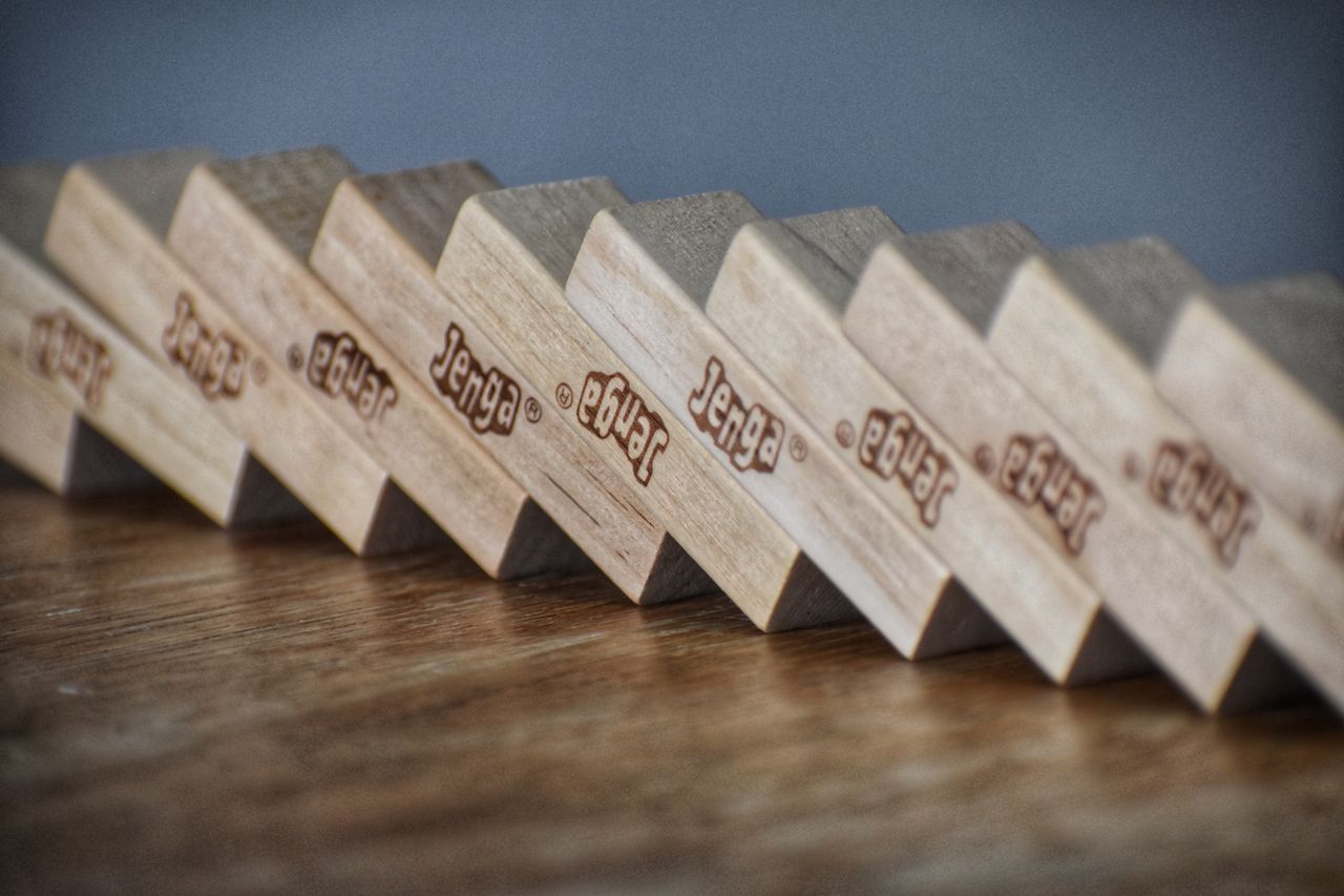 Closeup of wooden blocks placed in row on table for playing party game